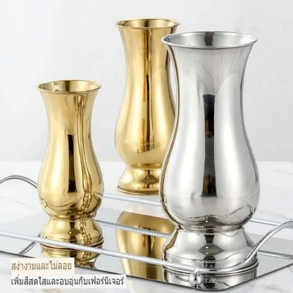 Silver stainless steel single stem vase on minimalist white table display