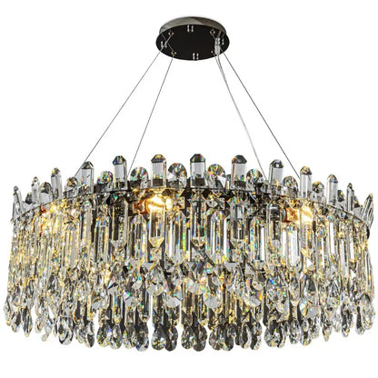 Chrome oval crystal chandelier, 33.5 inches long, above a dining table