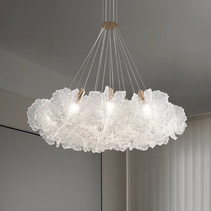 Engraved acrylic petal detail on an art deco nickel chandelier frame