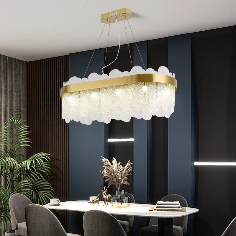 Gold chandelier at 39.4 in across in warm light, bulbs not included