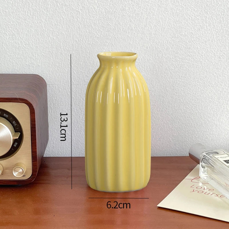 Mini ceramic bud vase on wooden tray living room styling
