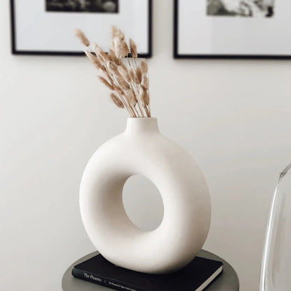 Small Nordic hollow donut ceramic vase as shelf accent with dried pampas grass