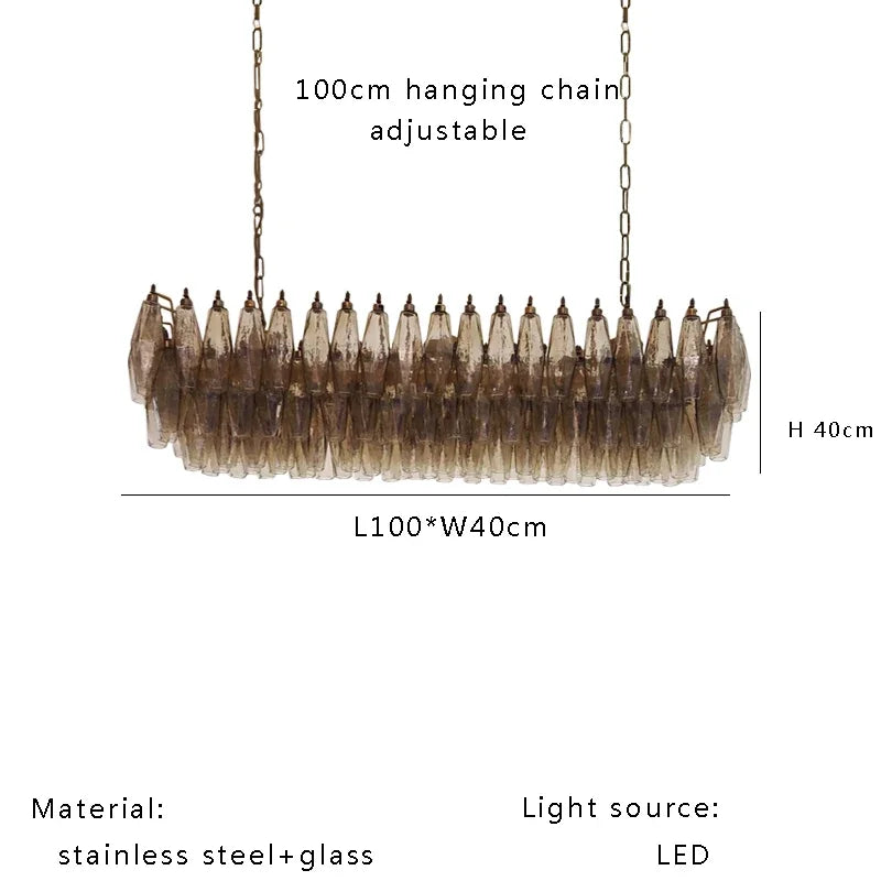 Polished steel chandelier frame holding clear glass shades in a loose mass