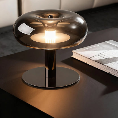 Silver jellyfish lamp casting warm ambient glow in dining room