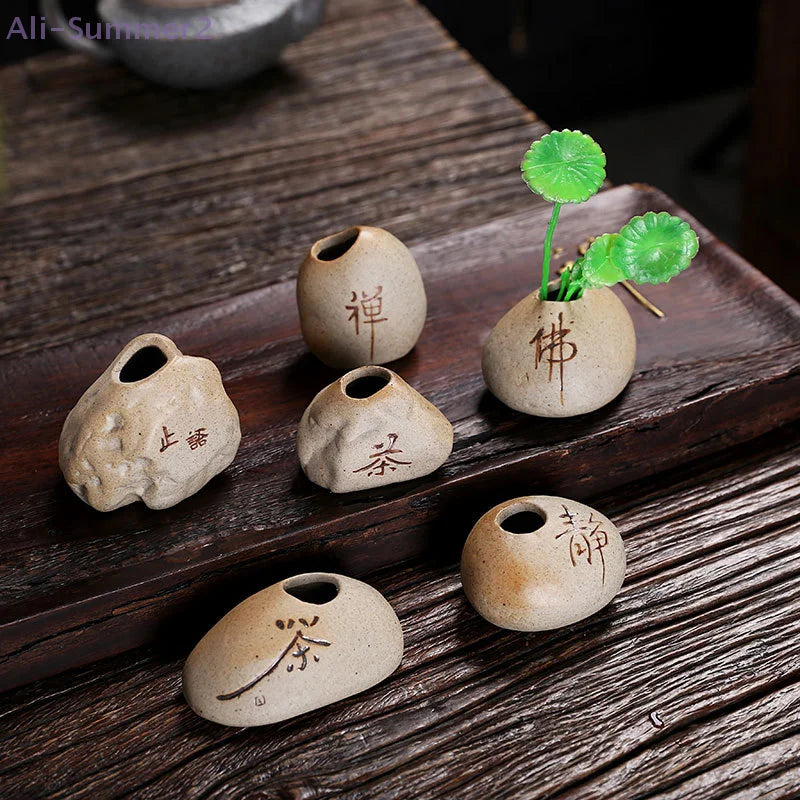 Chinese-inspired stone imitation ceramic mini vase with dried stem arrangement on desk