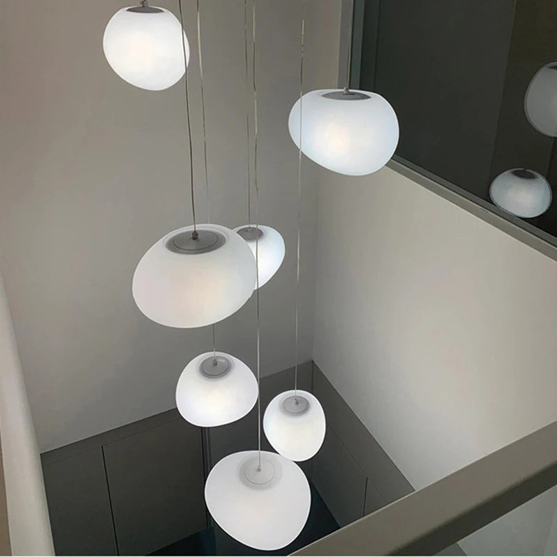 Modern acrylic stair chandelier with shades hung at mixed lengths