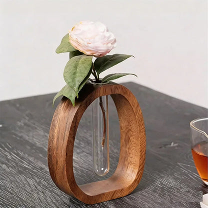 Brown walnut wood glass hydroponic vase with trailing plant cutting in water