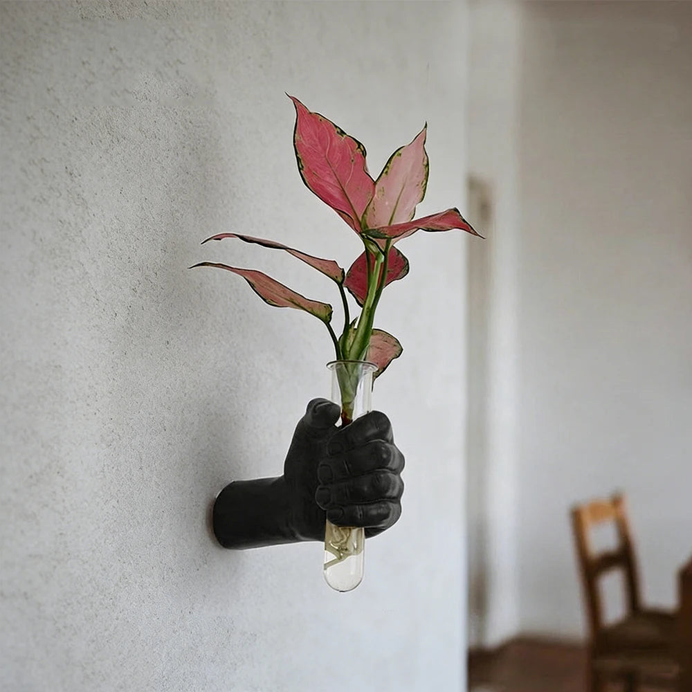 Side profile of resin boxer hand vase showing grip detail and mounted base