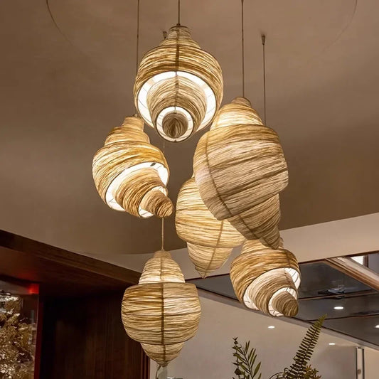 Vintage conch chandelier with a wound fabric shade on an iron frame