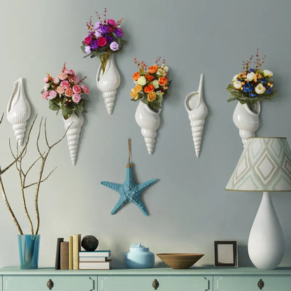 Right-mouth ceramic shell wall vase with small dried botanical arrangement