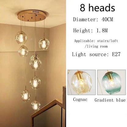 Glass globe chandelier on a polished gold chassis for a loft void
