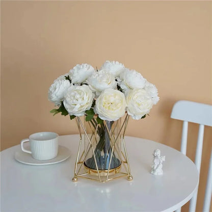 Gold geometric iron vase as a striking entryway display on a console table