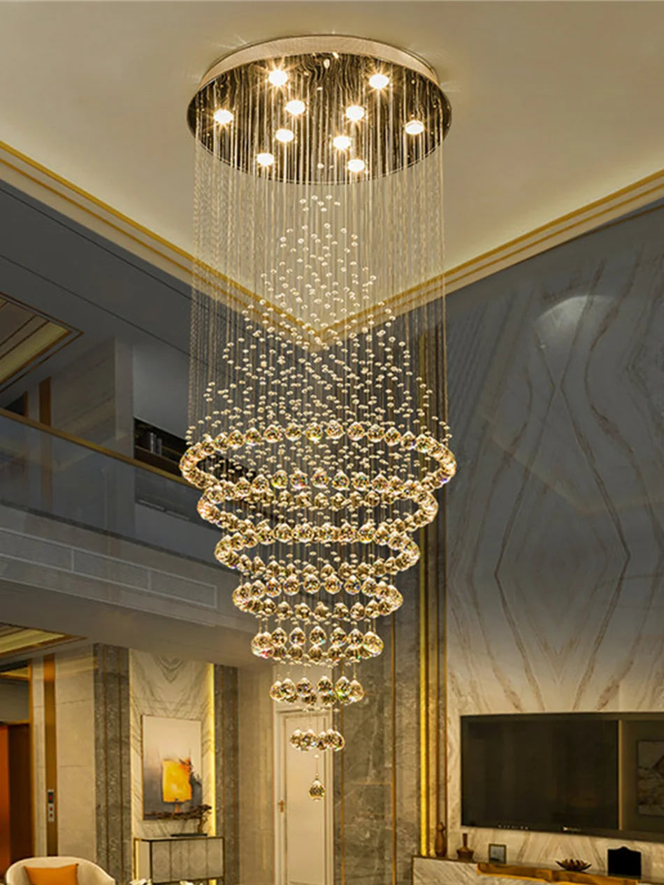 Circular crystal lobby chandelier with crystal rings on polished chrome