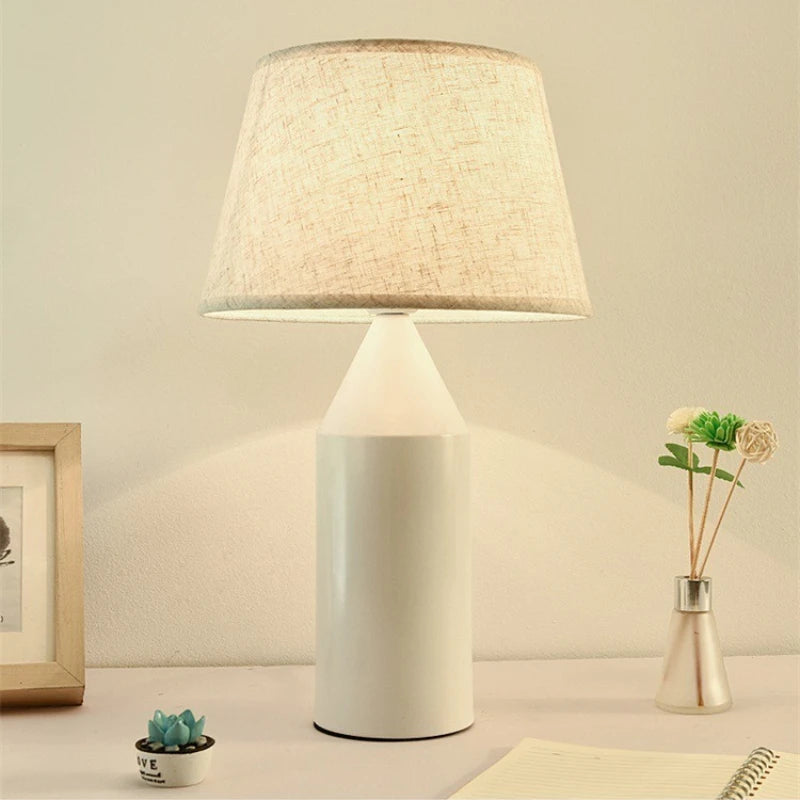 Minimalist black metal art table lamp on Nordic bedroom nightstand