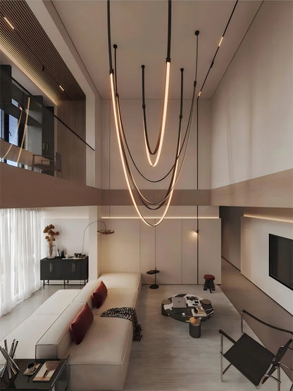 Leather belt linear chandelier with a strap slung between two ceiling fixings