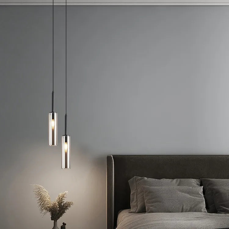 Gold two head chandelier with independently adjustable cord drops
