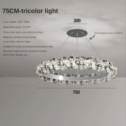 Crystal ring chandelier lit in cool white through radiating petals