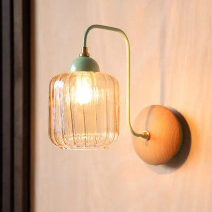 amber glass wall sconce, close-up of shade and hardware detail