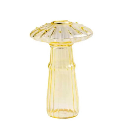 Vibrant mushroom-shaped glass vase as statement accent on eclectic dining table