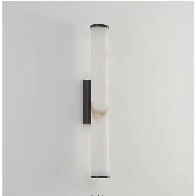 black marble wall sconce, detail view of fixture base and arm