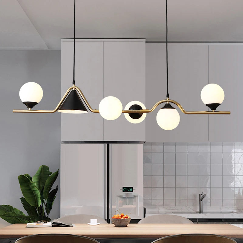 Smoky grey glass chandelier on an ironwork bar with remote dimming