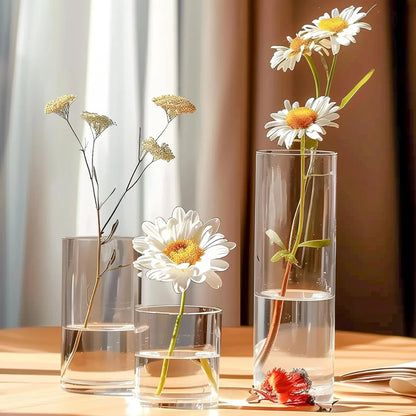 Clear glass cylinder vase 20cm tall with fresh flowers for dining table display