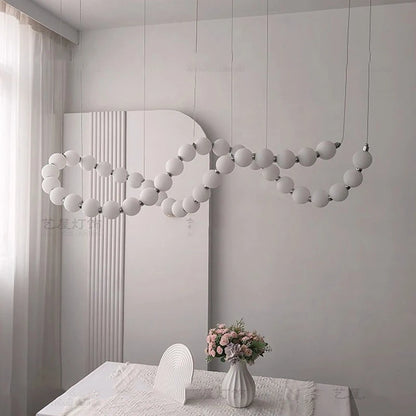 Gold linear strip chandelier at 78.7 in length on a cord pendant