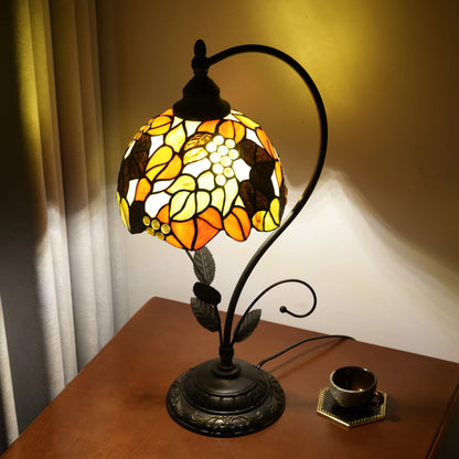 Metal leaf base of stained glass table lamp close-up structural view
