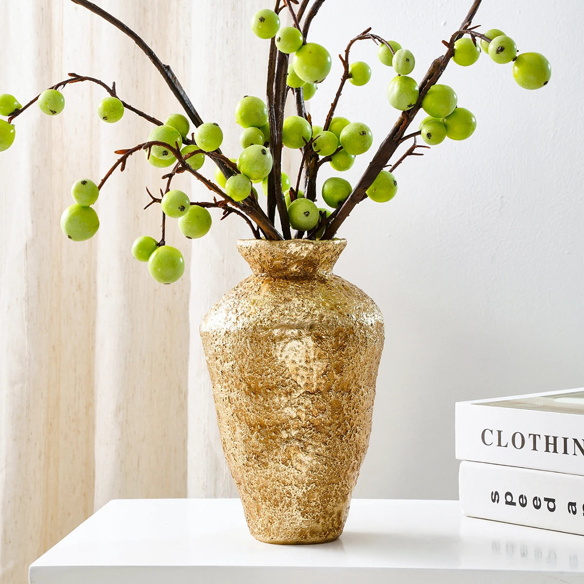 Close-up of antique gold aged finish texture on earthenware jar decorative vase
