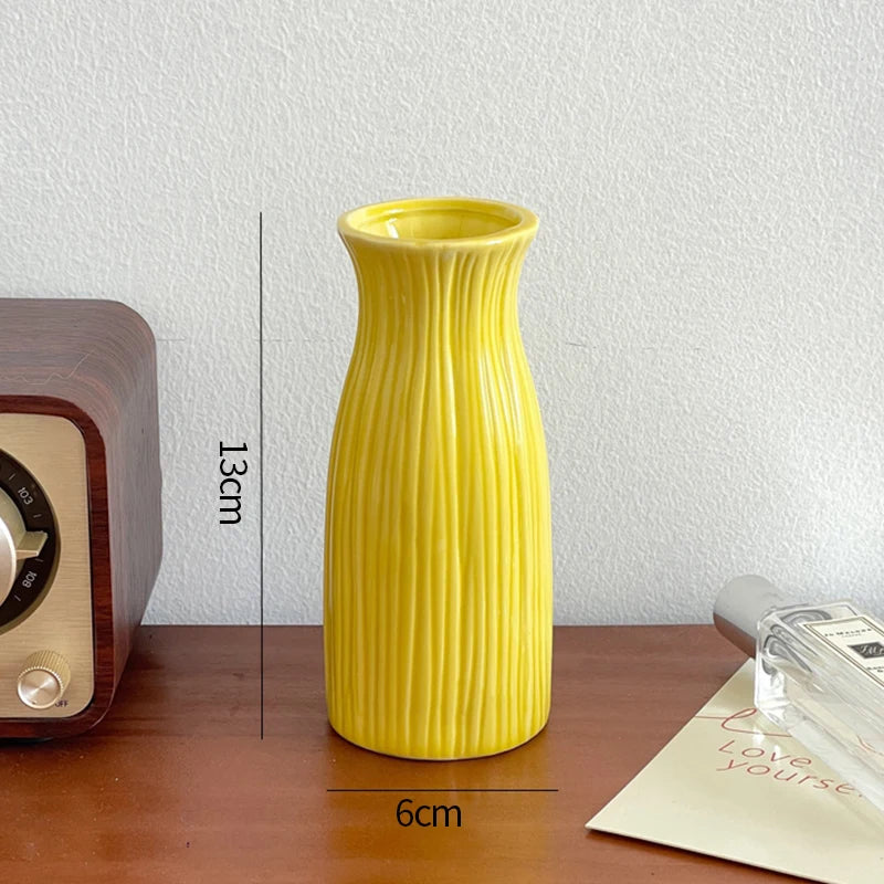 Small ceramic decorative vases arranged in group display