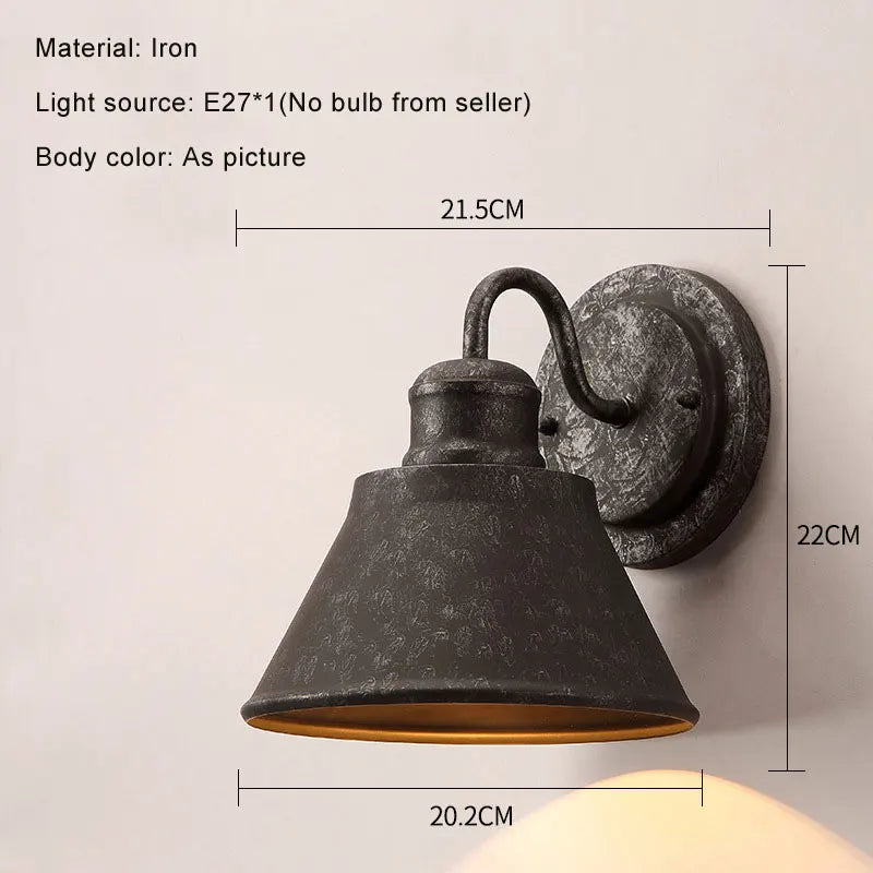 iron outdoor wall sconce, side profile showing mounting depth