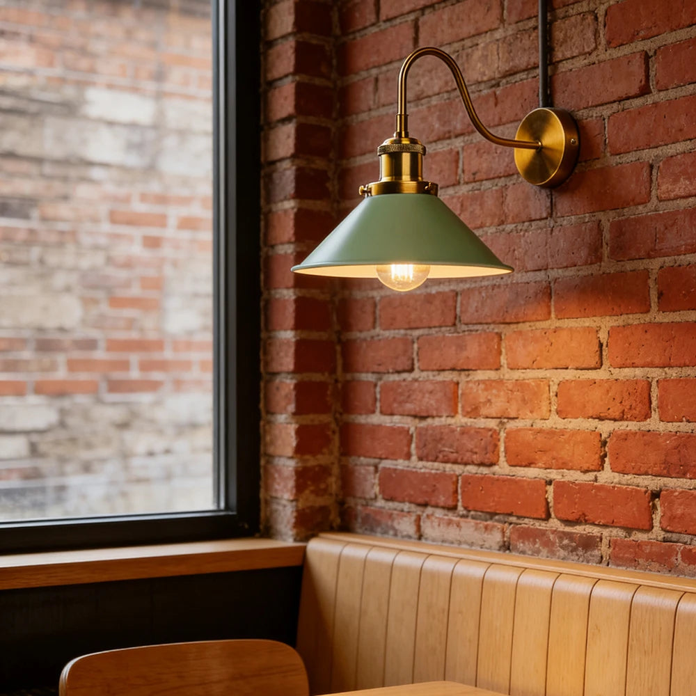 green brass wall sconce, close-up of shade and hardware detail