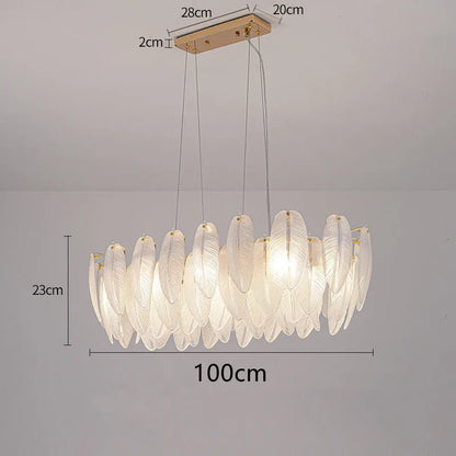 Feather glass chandelier lit in neutral 4000K light on gold metal