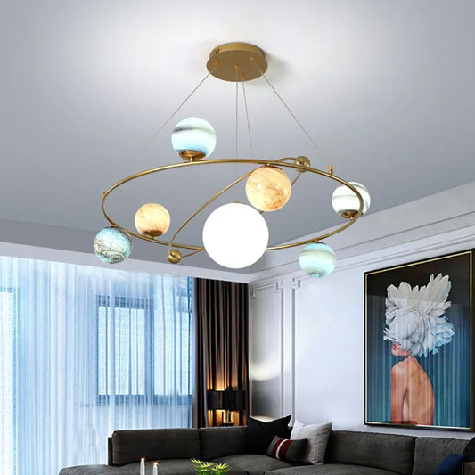 Nordic planet globe chandelier with gold plated metal arms and spheres