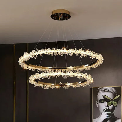 Four ring stacked chandelier in gold with graduated glass diameters