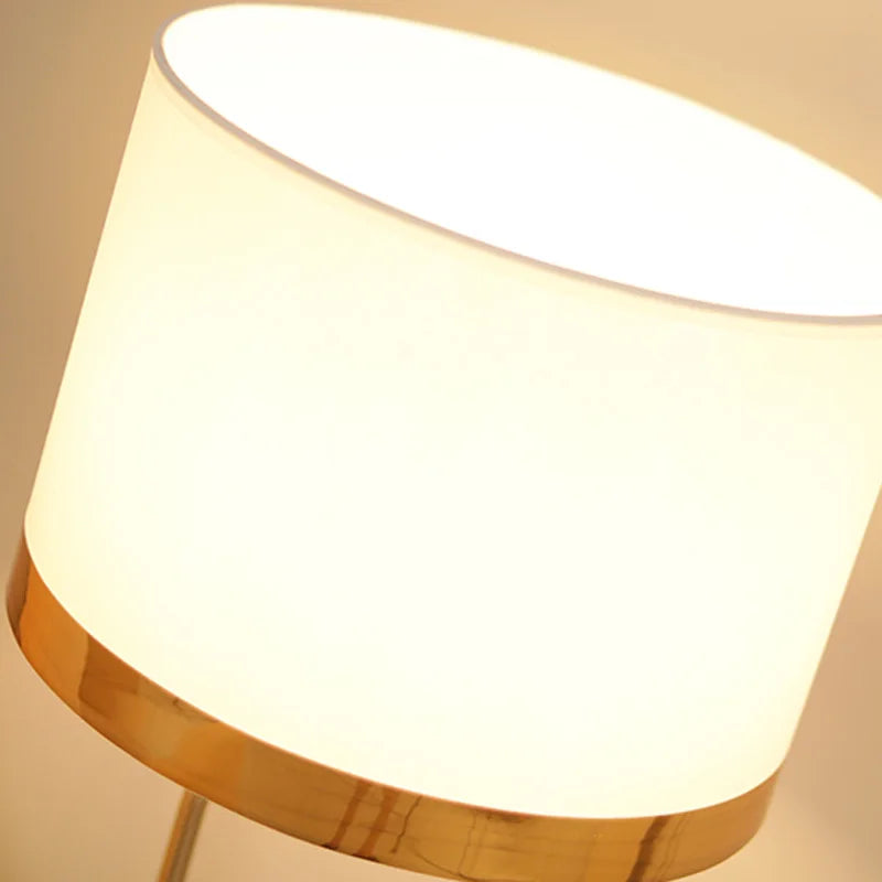 Copper lustre lamp switched on warm glow on bedroom nightstand
