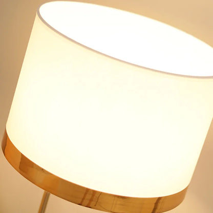 Copper lustre lamp switched on warm glow on bedroom nightstand