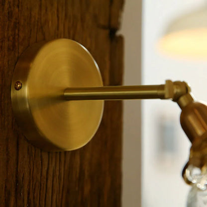 glass bathroom wall sconce, detail view of fixture base and arm