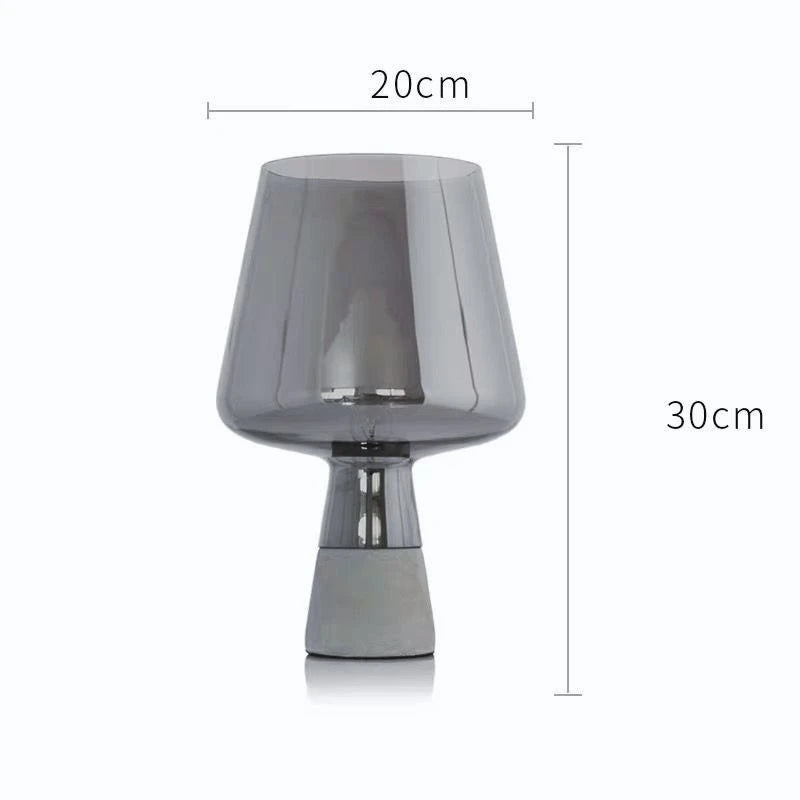 Amber and dark gray glass lamp versions displayed side by side