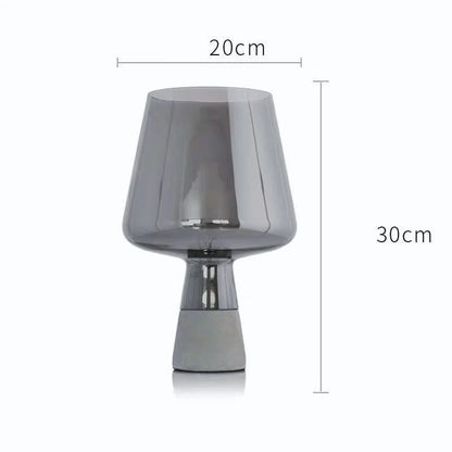 Amber and dark gray glass lamp versions displayed side by side