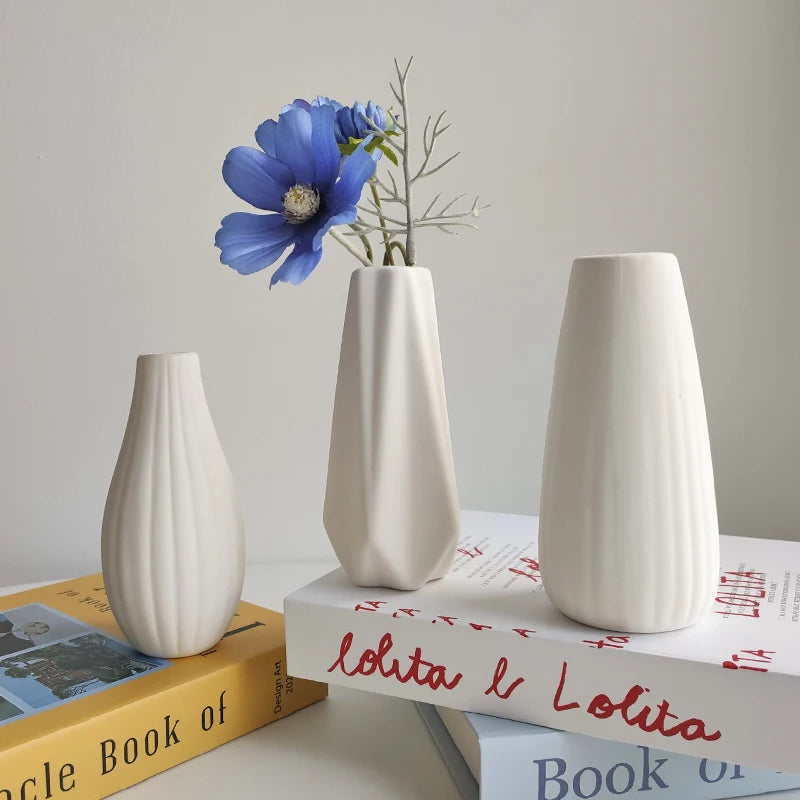 Close-up of smooth matte white ceramic glaze on Nordic decorative bud vase surface