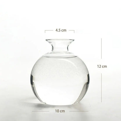 Four avocado glass vases in different sticker styles displayed together