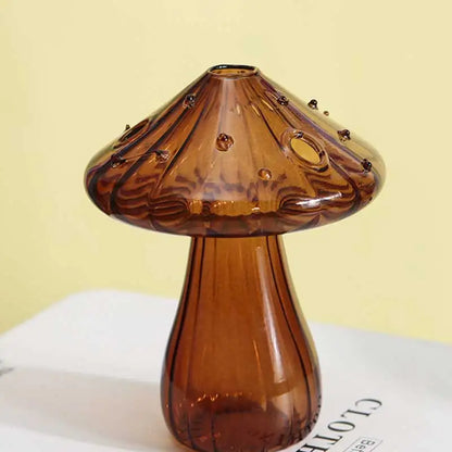 Glass aromatherapy mushroom vase on modern side table with botanical decor