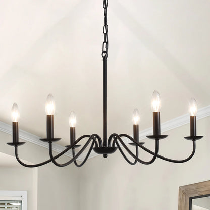 Bare socket detail on a retro metal chandelier arm in painted black