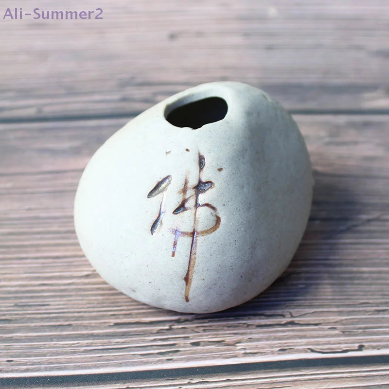 Close-up of stone imitation finish texture on mini Chinese-style decorative ceramic vase