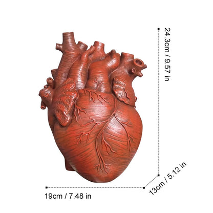 Heart-shaped resin flowerpot presented as gift with wrapping