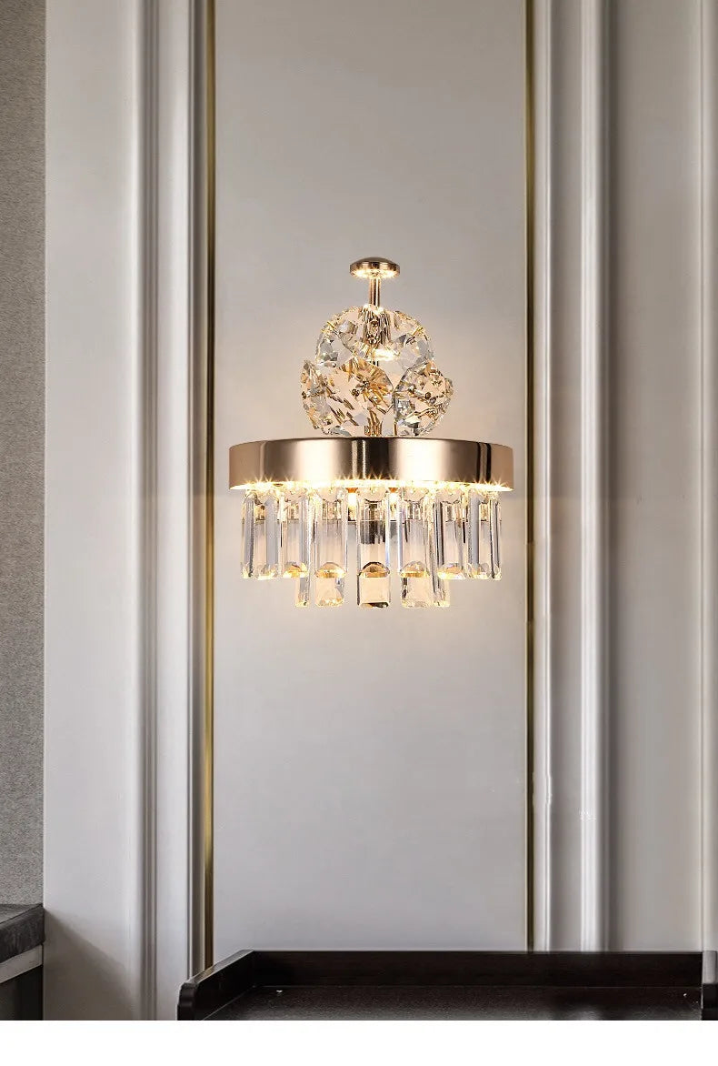 Plated iron chandelier frame carrying rows of clear crystal elements