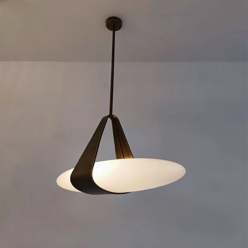 Leather chandelier with three staggered shades on a metal cord pendant