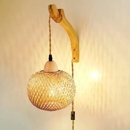 rattan wall sconce, detail view of fixture base and arm