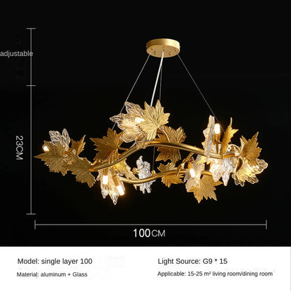 Plated gold chandelier frame holding rows of faceted crystal maple leaf shapes